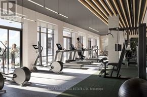 Toronto (Islington-City Centre West) condo for rent - A gym with a variety of equipment including treadmills, weights, and exercise machines.