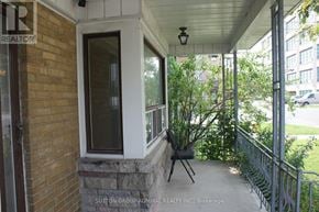 Toronto (Briar Hill-Belgravia) apartment for rent - A balcony with a brick wall and a metal railing.
