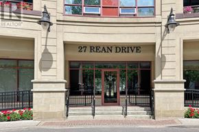 Toronto (Bayview Village) condo for rent - The front of a building with the sign 27 Rean Drive.