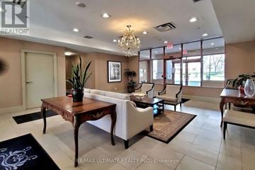 Toronto (Bayview Village) condo for rent - A living room with a wooden table and white chairs.