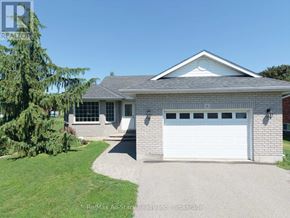 Kawartha Lakes (Lindsay) apartment for rent - A house with a white garage door is for sale.