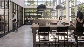 Toronto (Highland Creek) condo for rent - A brokerage office with people working at desks and a man walking in.