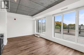 Toronto (South Riverdale) condo for rent - A room with a fireplace and sliding glass doors.