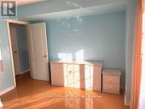 Toronto (Rouge) apartment for rent - A room with a white door and a white dresser with a window behind it.