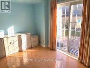 Toronto (Rouge) apartment for rent - A room with a sliding glass door leading to a balcony.