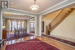 Markham (Cornell) apartment for rent - A spacious room with a dining table and chairs is shown.