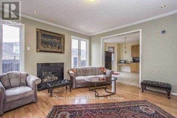 Markham (Cornell) apartment for rent - A living room with a fireplace and a painting on the wall.