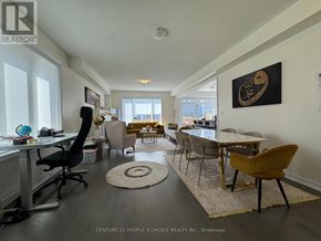 Barrie apartment for rent - A well-lit room with a dining table and chairs.