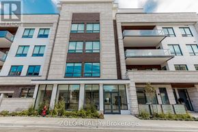 Oakville (Co Central) condo for rent - A modern building with a glass entrance and balconies.