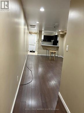 Toronto (Weston-Pellam Park) multi-family for rent - A long hallway with a table and chairs in the distance.