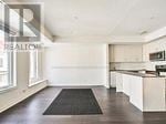 Toronto (Long Branch) townhouse for rent - A black mat is on the floor of a white room.