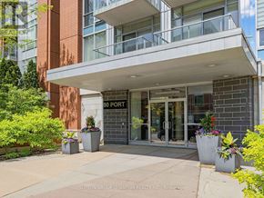 Mississauga (Port Credit) condo for rent - The image shows the front of a building with a glass entrance and a sign that reads "30 PORT".