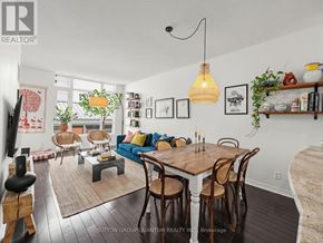 Mississauga (Port Credit) condo for rent - A dining room with a wooden table and chairs.