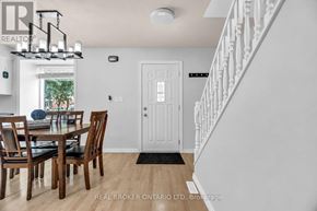 London East (East D) apartment for rent - A dining room with a white door and a chandelier.