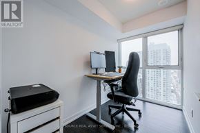 Toronto (Mount Pleasant West) condo for rent - A room with a desk, chair, and printer.