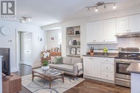 Toronto (Mount Pleasant East) duplex for rent - A living room with a couch, a coffee table, and a television.