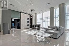 Richmond Hill (Langstaff) condo for rent - A modern living room with a glass table and grey sofas.