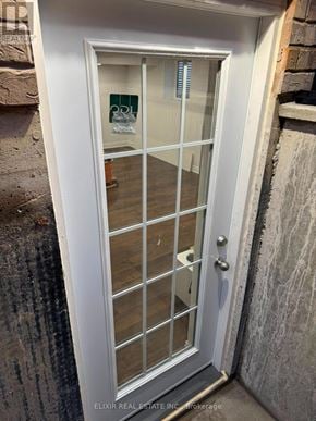 Burlington (Alton) apartment for rent - A white door with a glass panel and a handle.