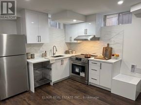 Burlington (Alton) apartment for rent - A modern kitchen with white cabinets and stainless steel appliances.