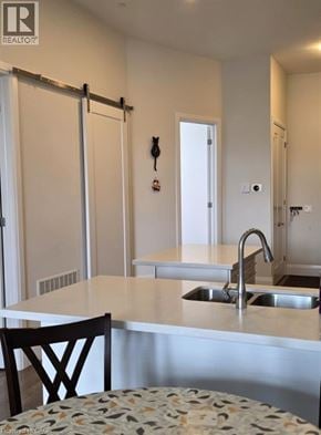 Brantford condo for rent - A kitchen with a sink and a chair.