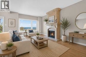 Stoney Creek townhouse for rent - A living room with a fireplace and a view of the ocean.
