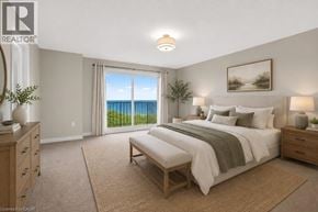 Stoney Creek townhouse for rent - A bedroom with a large bed and a view of the ocean through the window.