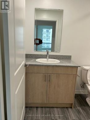 Guelph (Willow West/Sugarbush/West Acres) condo for rent - A bathroom with a sink, mirror, and toilet.