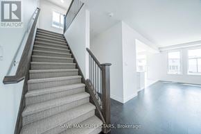 London South (South W) apartment for rent - A staircase with a carpeted runner and wooden handrails.
