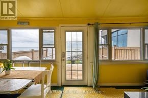 Fort Erie (Crystal Beach) apartment for rent - A dining room with a table and chairs is shown.