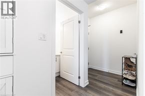 Waterdown condo for rent - A white door is open to a hallway.