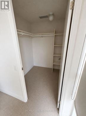Toronto (Church-Yonge Corridor) condo for rent - A white bedroom with a door open to a hallway.