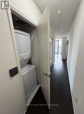 Toronto (Church-Yonge Corridor) condo for rent - A white washer and dryer are in a small alcove.