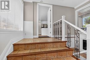 Ottawa apartment for rent - A staircase with a metal railing and wooden steps.