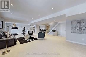 Richmond Hill (Jefferson) apartment for rent - A spacious living room with a staircase in the background.