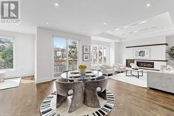 Toronto (Bedford Park-Nortown) apartment for rent - A modern living room with a large table and chairs.