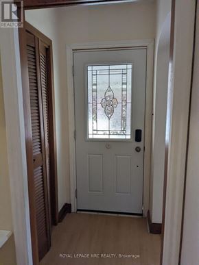 Port Colborne (Main Street) apartment for rent - A white door with a glass window in the middle of it.
