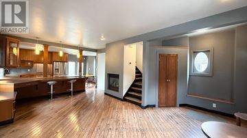 London South (South E) apartment for rent - A spacious open floor plan with a kitchen, dining area, and living room.