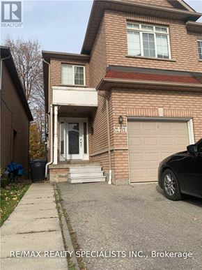 Mississauga (Hurontario) apartment for rent - A house with a car parked in front of it.