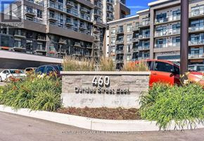 Hamilton (Waterdown) condo for rent - A street sign for Dundas Street East stands in front of a building.