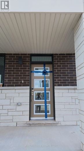 Barrie townhouse for rent - A door with a blue tape on it.