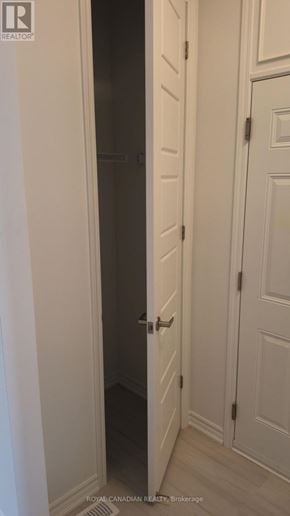 Barrie townhouse for rent - A white door with a black handle is open.