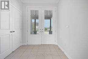Loyalist (Bath) apartment for rent - A white room with a glass door leading outside.