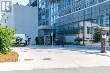 Toronto (Agincourt South-Malvern West) condo for rent - A modern building with a glass facade and a white exterior is shown.