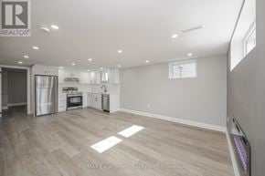 Hamilton (Hampton Heights) apartment for rent - A kitchen with a refrigerator, oven, and cabinets.