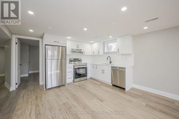 Hamilton (Hampton Heights) apartment for rent - A kitchen with white cabinets and stainless steel appliances.