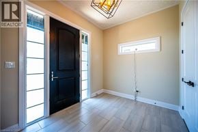 Kitchener apartment for rent - A room with a black door and a window with a white frame.