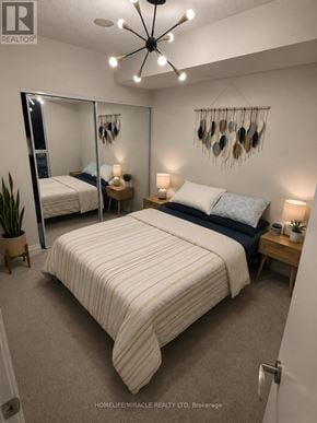 Toronto (Islington-City Centre West) condo for rent - A bedroom with a large bed and a mirror on the wall.