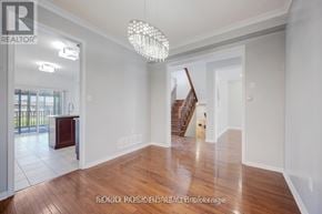 Brampton (Credit Valley) apartment for rent - A large, empty room with a wooden floor and white walls.