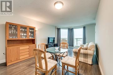 Mississauga (Erin Mills) condo for rent - A living room with a glass table and chairs.
