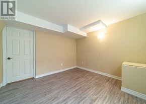 Milton (Be Beaty) apartment for rent - A room with a door and a light on the ceiling.